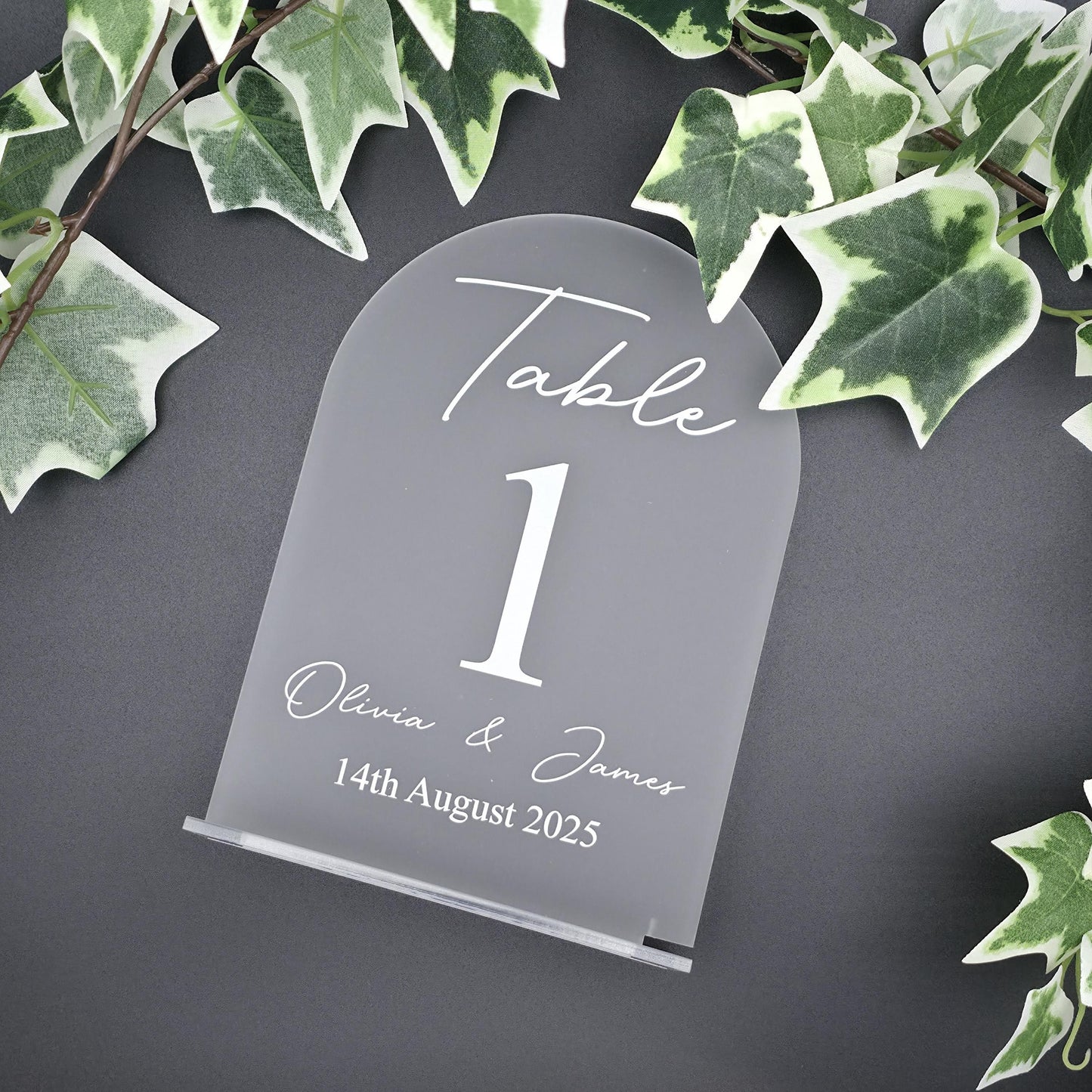 frosted acrylic wedding table seating sign with elegant font