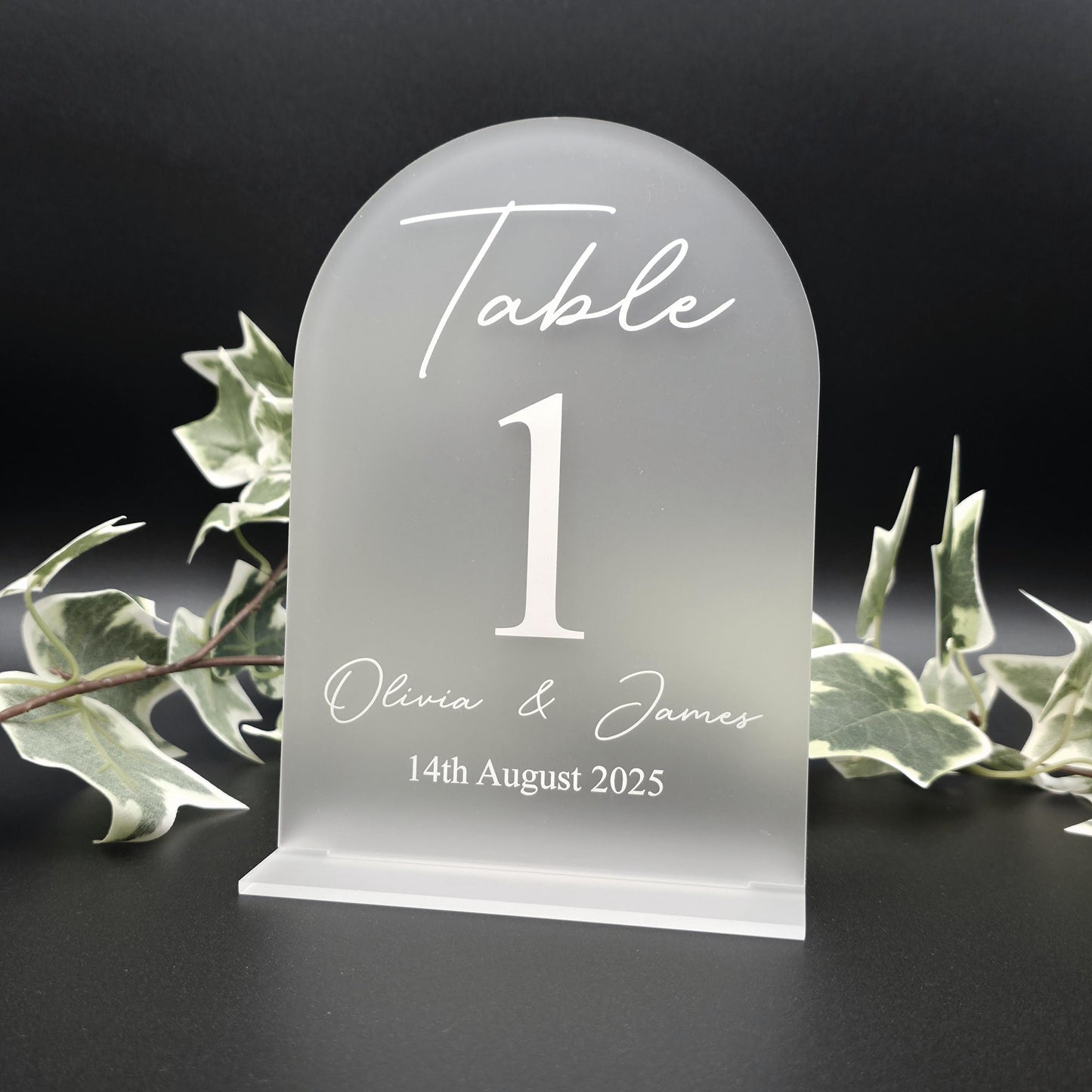 Personalised acrylic seating chart with guest names wedding table number