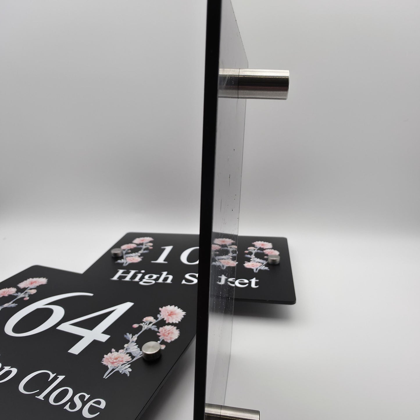 A beautiful floral house number sign plaque used as a modern front door address marker