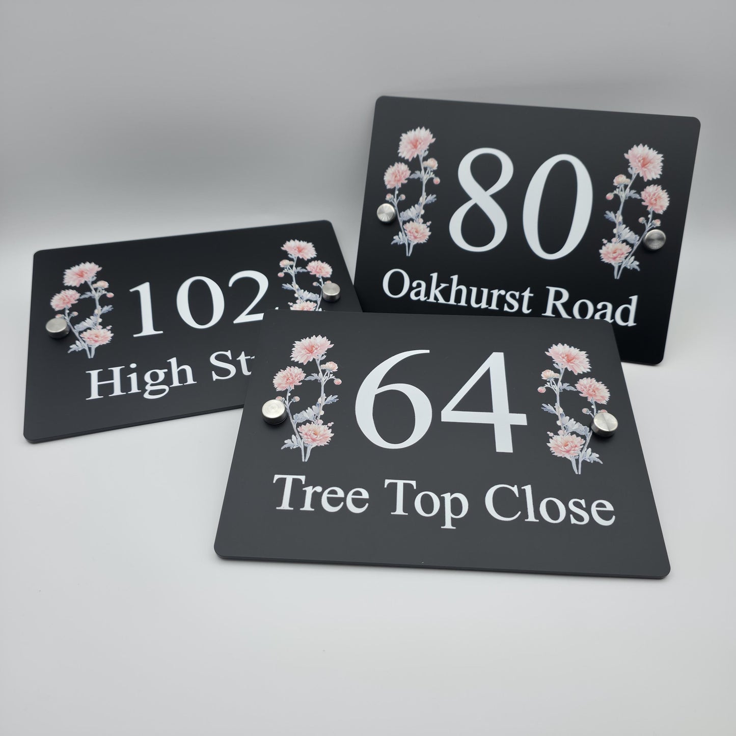 Custom floral address plaque with a vibrant printed design, enhancing the kerb appeal of a home's exterior
