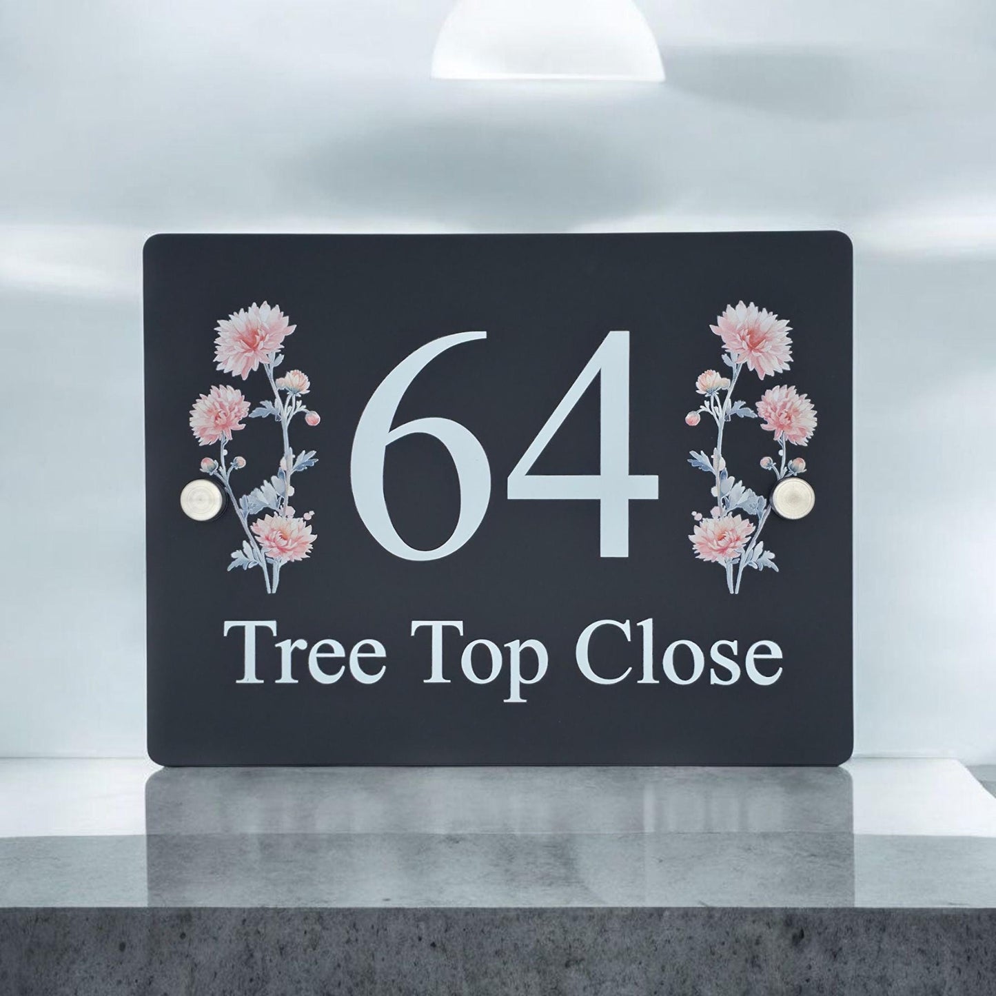 A rectangular acrylic door number plate featuring a decorative floral pattern and custom house details