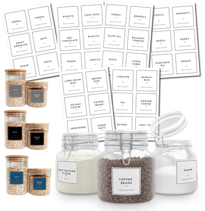 A set of clear glass jars with black and white labels for organising pantry staples. The labels include names like oats, brown rice, coffee beans, sugar, and self-raising flour.