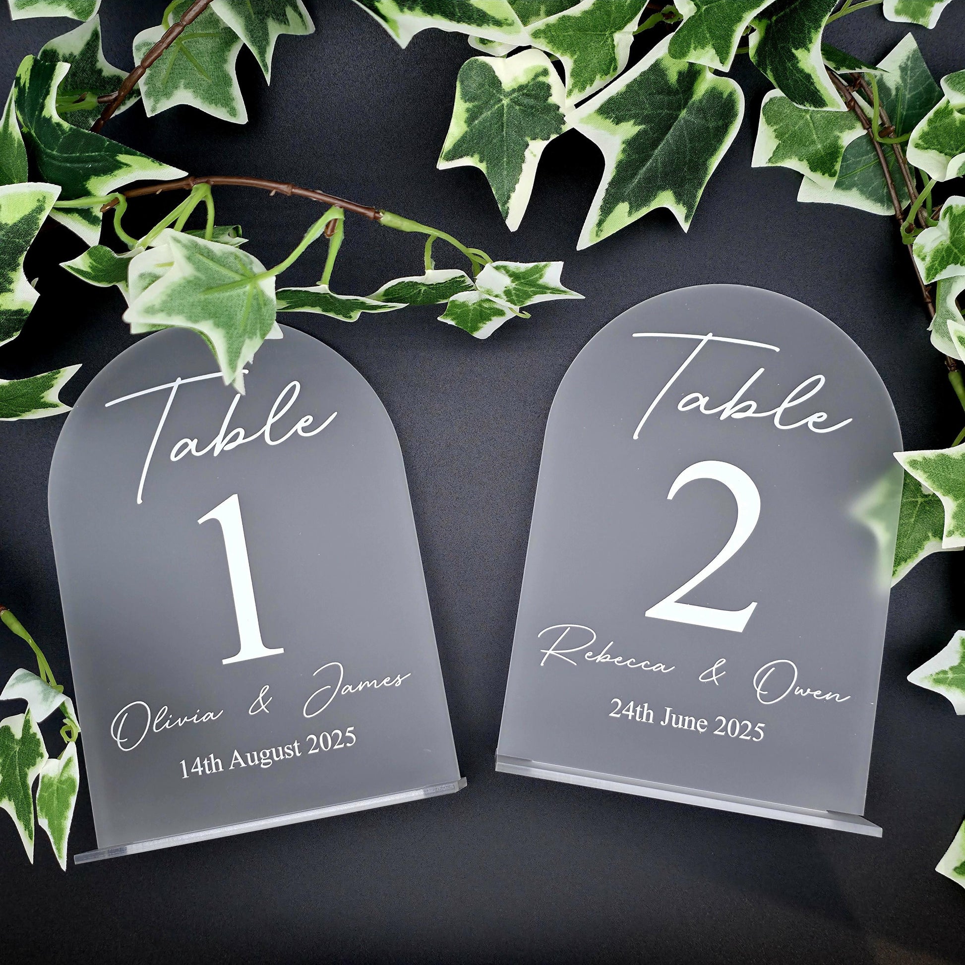 Wedding seating sign on frosted acrylic with elegant writing