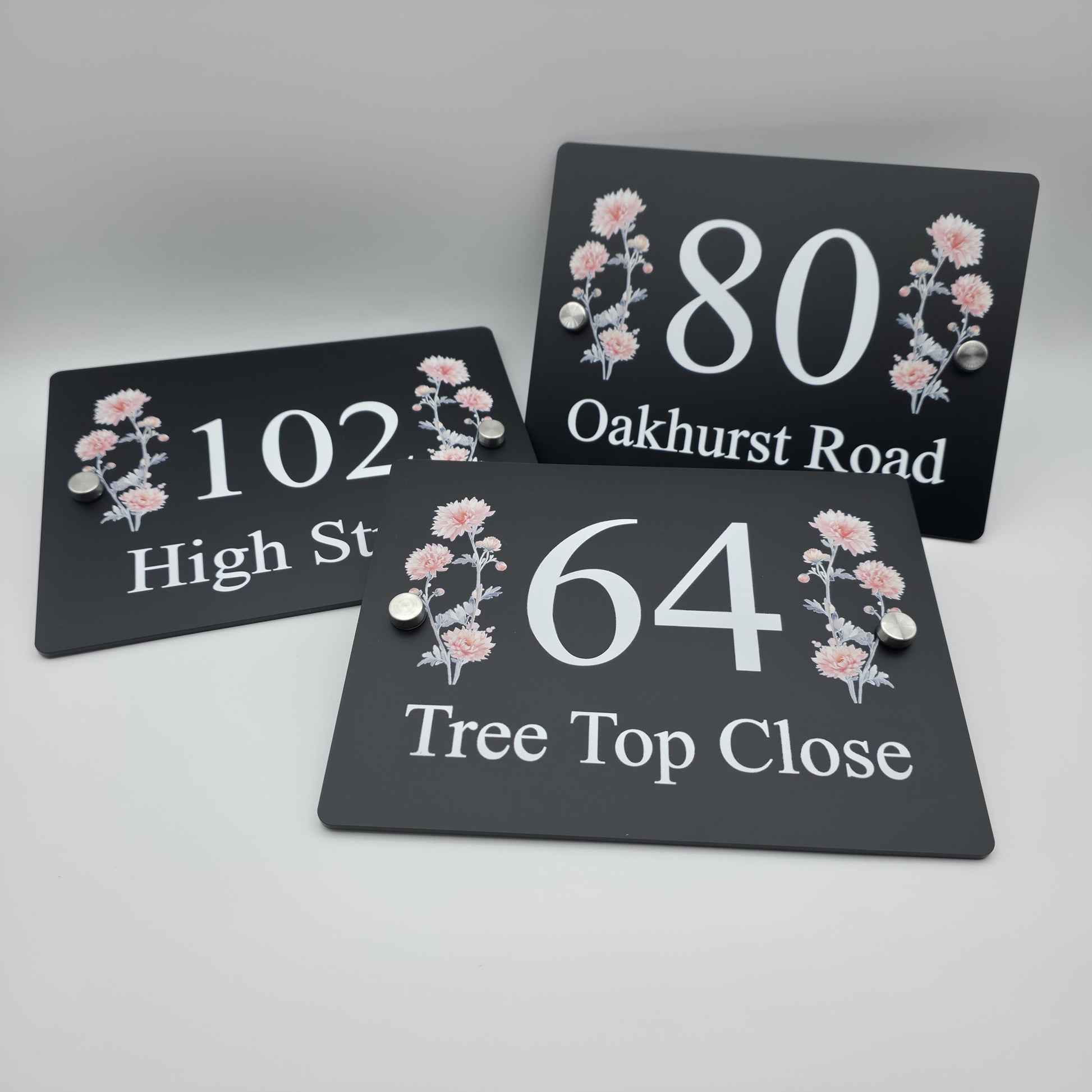 Custom floral address plaque with a vibrant printed design, enhancing the kerb appeal of a home&#39;s exterior