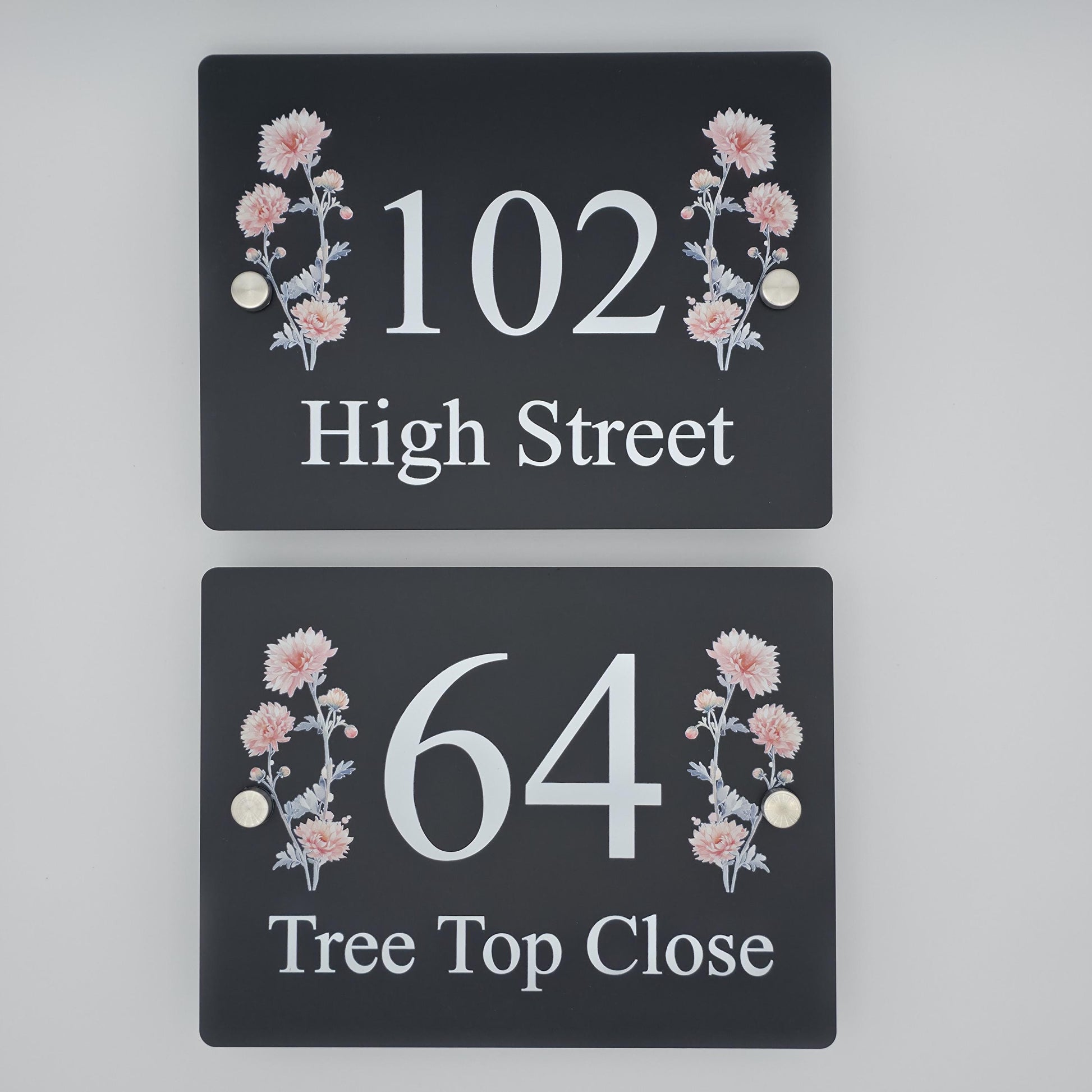 Modern acrylic house number plaque featuring a beautiful floral design, mounted with standoff fixings on a house wall