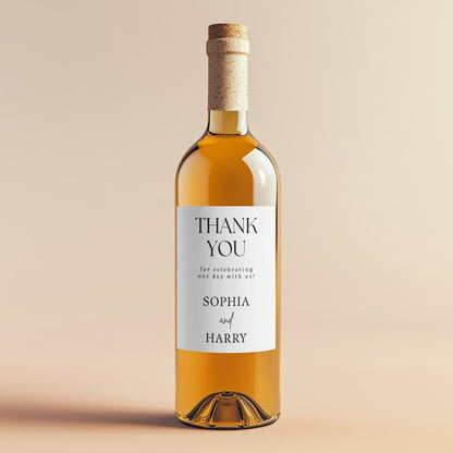 Close-up of custom wedding thank you wine label with two personalised names in elegant script