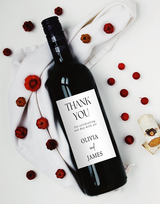 Personalised wedding wine bottle label saying “Thank you for celebrating our day with us”